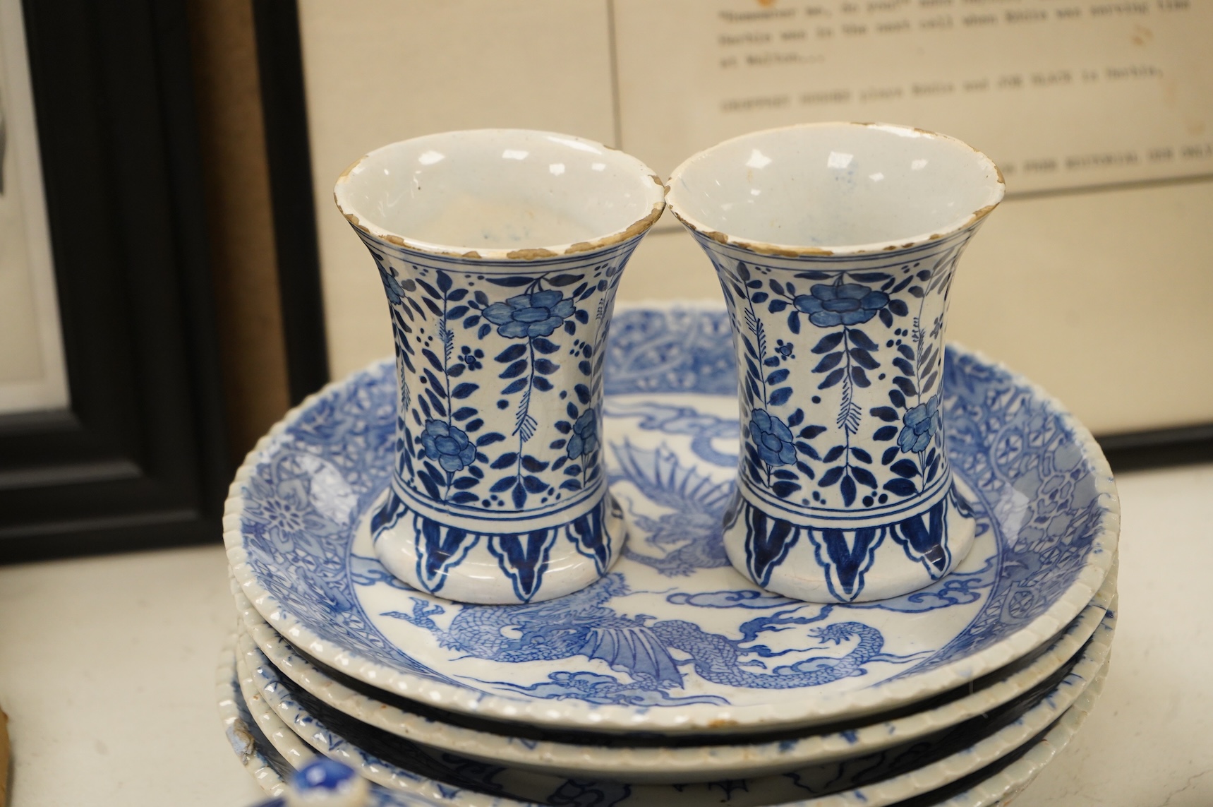 Group of blue and white Chinese porcelain and pottery to include dragon dishes and a pair of fish bowls, together with a pair of tin glazed vases, largest 21cm in diameter